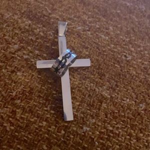 Stainless steel medium size cross charm.
